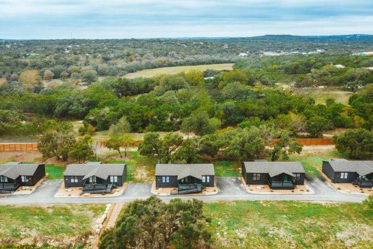Aerial view of modern cabins at Starlight Horizon in Canyon Lake Texas designed for group stays