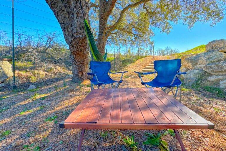 Outdoor seating area under oak tree at Starlight Horizon in Canyon Lake Texas