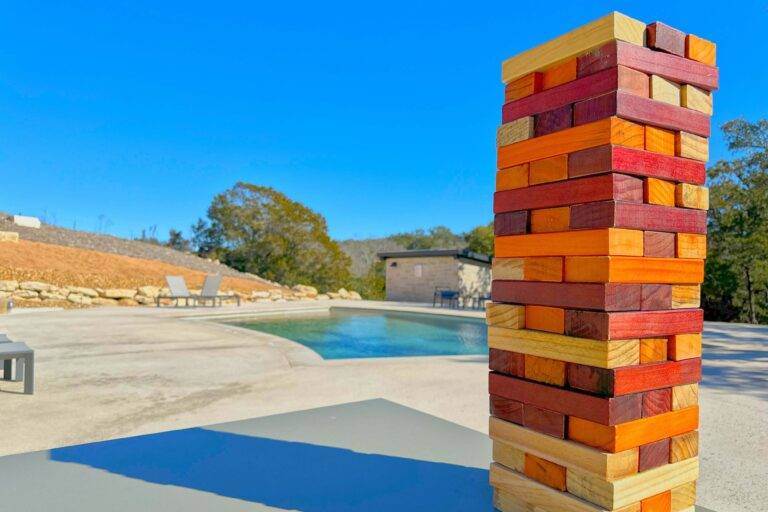 Giant Jenga game by the pool at Starlight Horizon in Canyon Lake Texas