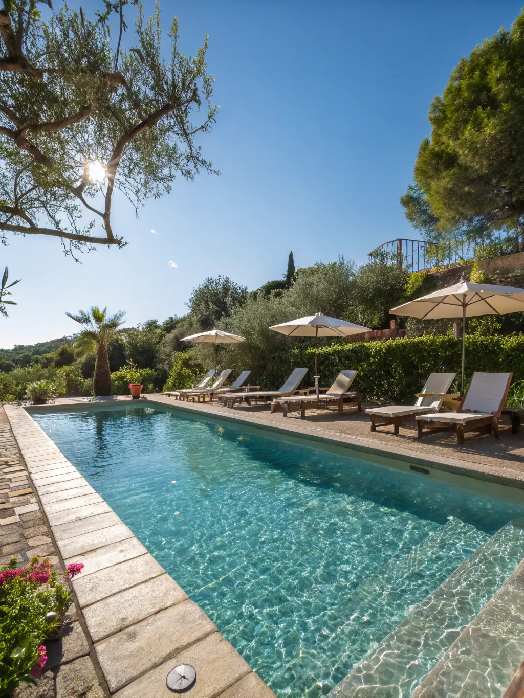 A photograph of the Starlight Horizon pool area at sunset, showcasing the crystal-clear water, comfortable lounge chairs, and ambient lighting, emphasizing relaxation and luxury.