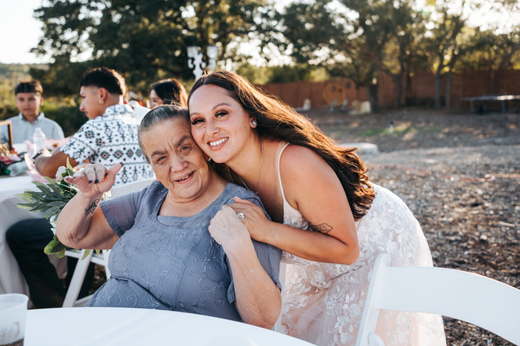 Bride with her grandmother at the reception at Starlight Horizon, a boutique cabin resort near Canyon Lake, Texas
