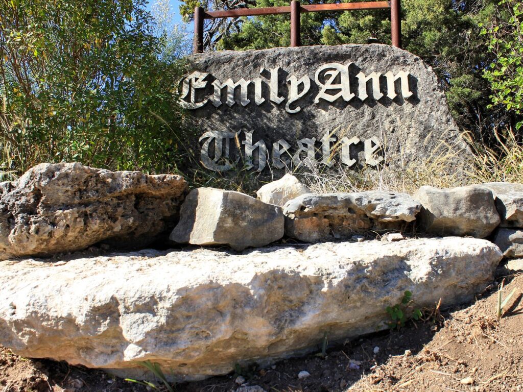 Carved stone EmilyAnn Theatre sign in Wimberley Texas