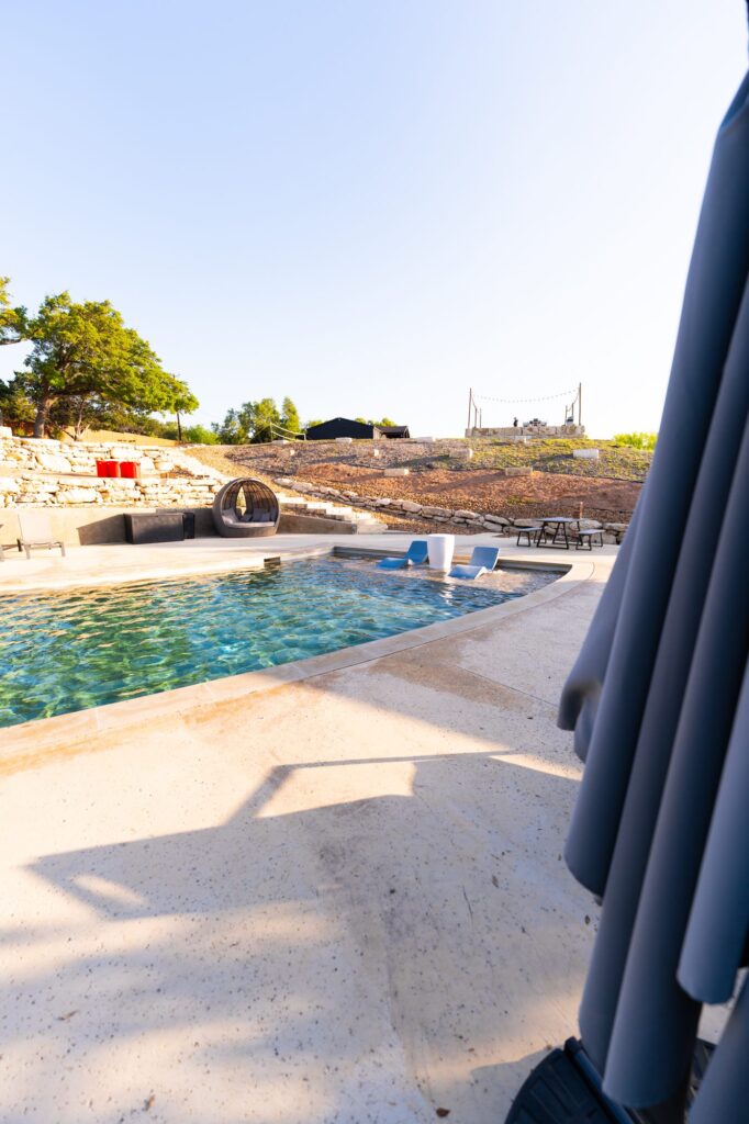 Pool deck and lounge seating on the terraced grounds at Starlight Horizon