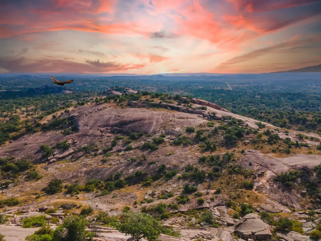 Rolling Texas Hill Country landscape of hills, oaks, and cedar breaks