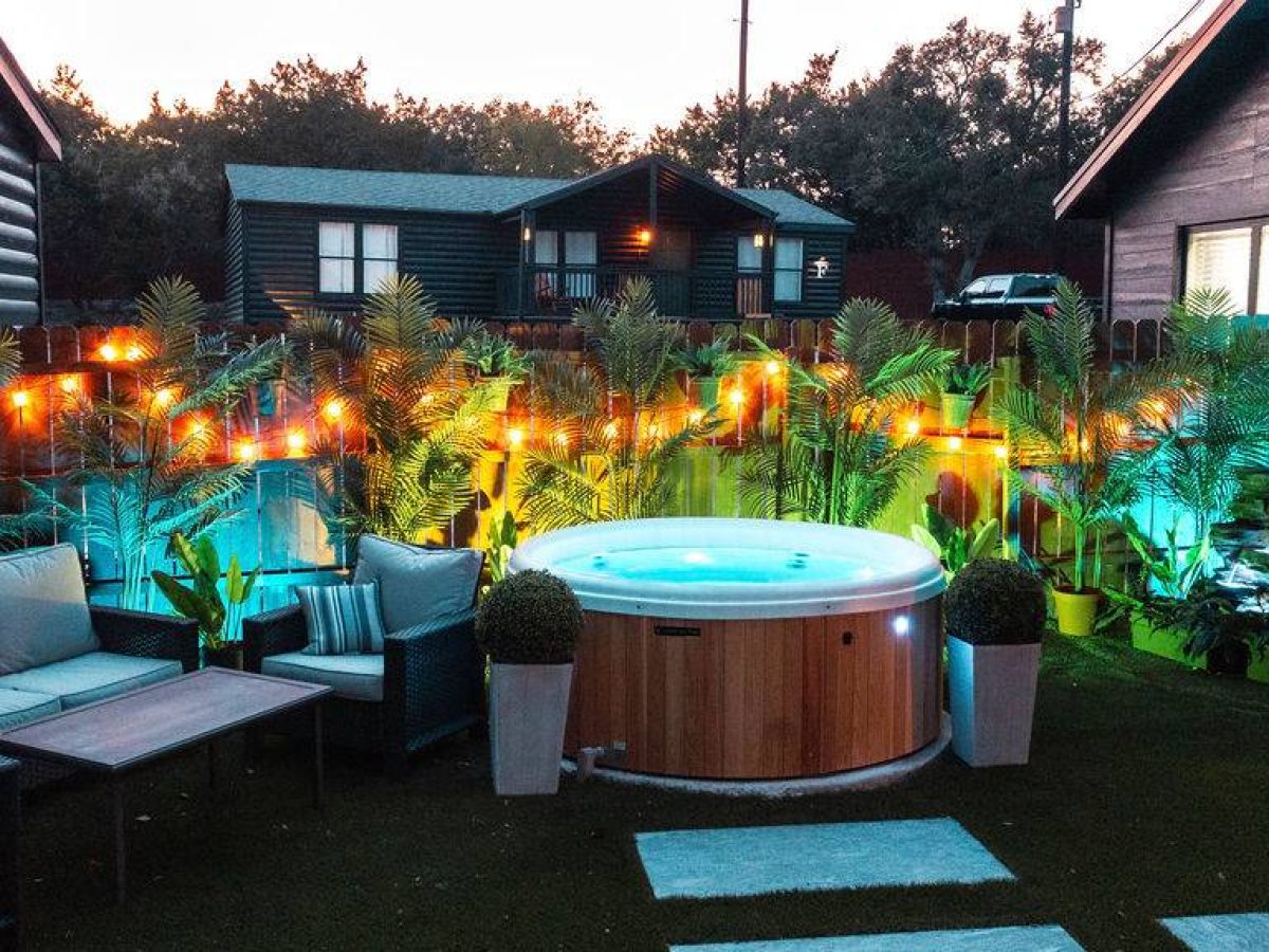 Hot tub under string lights at night at Starlight Horizon in Canyon Lake Texas
