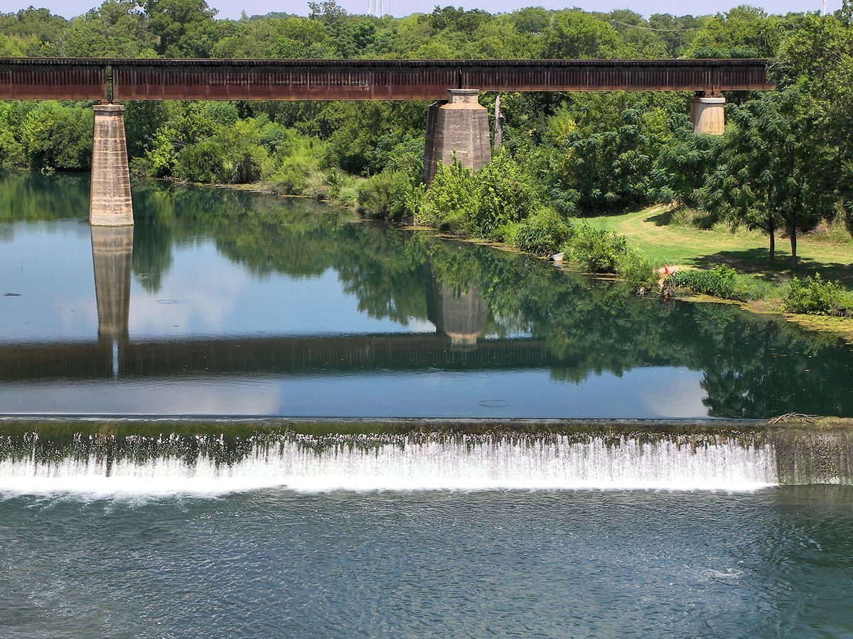 Water spilling over a low dam on the Guadalupe River near New Braunfels Texas