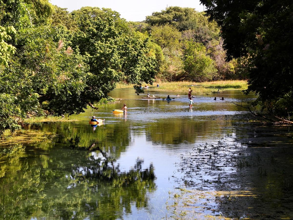 Tubers and kayakers cooling off in the spring fed San Marcos River